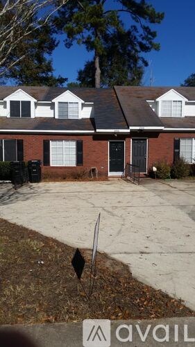 A house with a sign that says "available" in front of it.