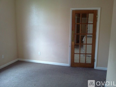 A room with a door and a window.