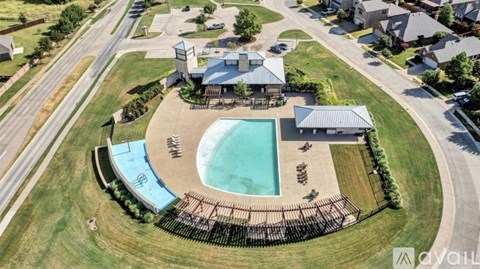 A large backyard with a pool and a deck.