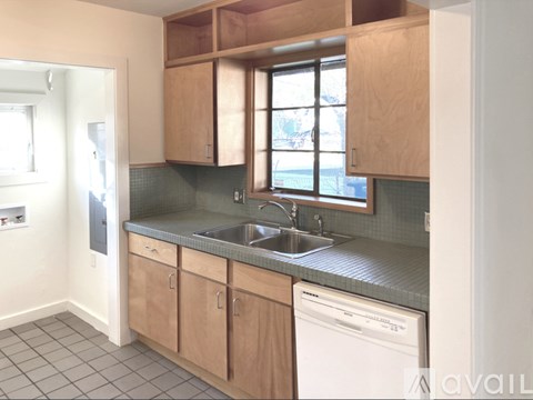 A kitchen with a dishwasher and a sink.