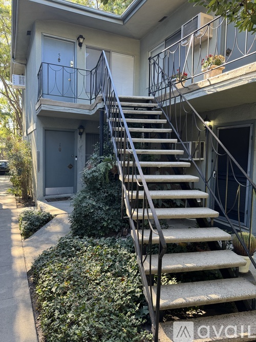A house with a staircase leading to the second floor.