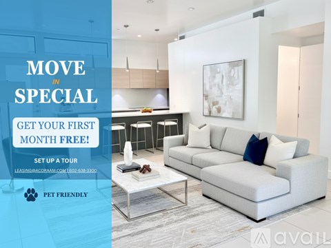 A modern living room with a couch, coffee table, and kitchen area, advertising a move-in special offer.