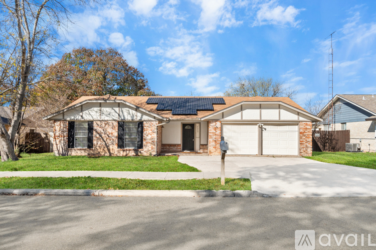 A house with solar panels on the roof is for sale.