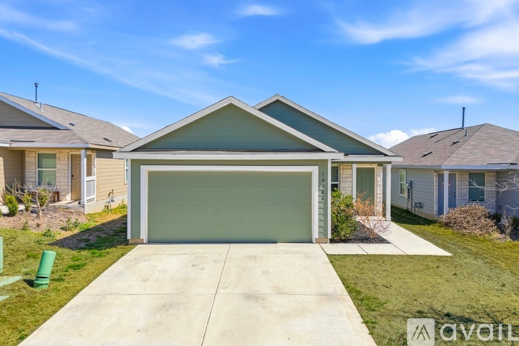 A house with a garage is for sale.