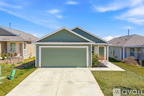 A house with a garage is for sale.