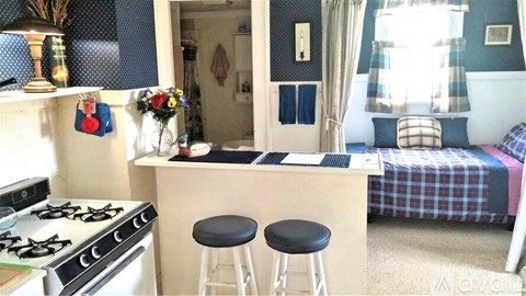 A small kitchen with a stove and a table.