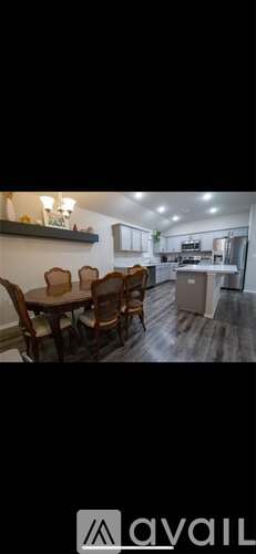 A dining area with a table set for four.