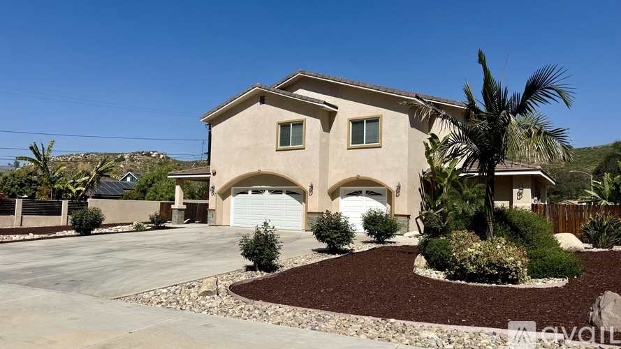 A house with a white garage door and a driveway.