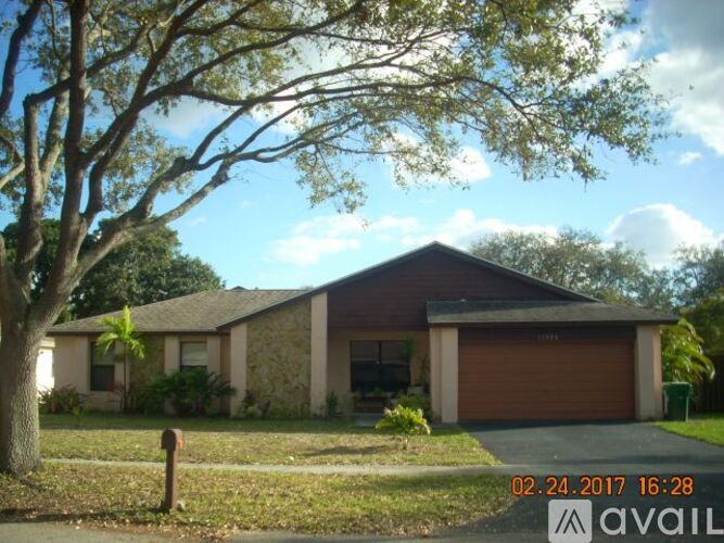 A house with a brown garage door is for sale.