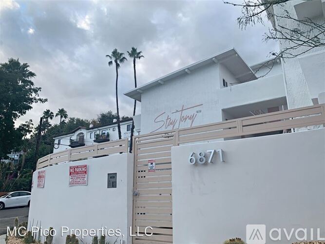 A white building with the number 6871 on it.