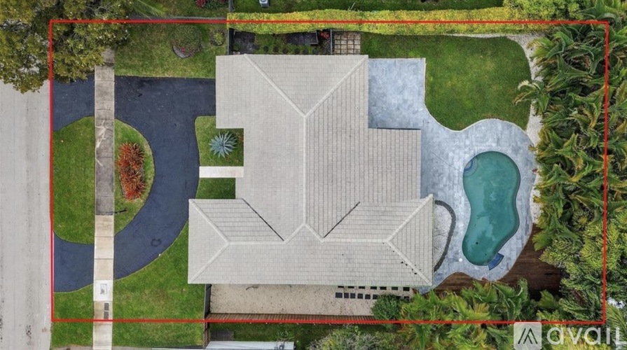 A modern house with a pool in the backyard.