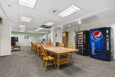A conference room with a Pepsi vending machine.