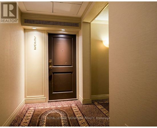 A hallway with a door and a sign that says "NOOK".