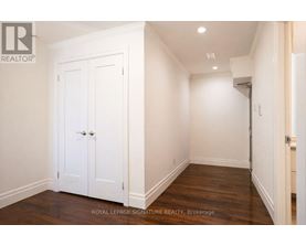 A white double door is in a white room.