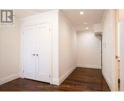 A white double door is in a white room.