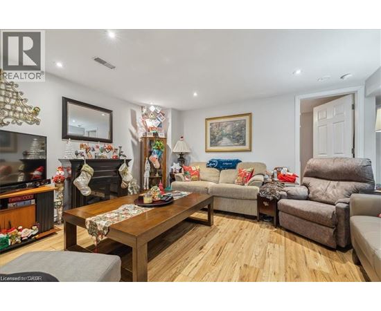 A living room with a fireplace and a couch.