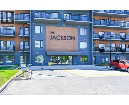 The Jackson apartment building is shown with a red car parked in front.