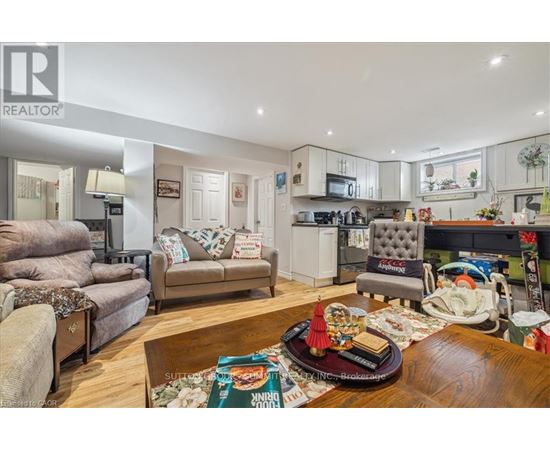 A living room with a couch, chair, and a coffee table.