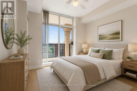 A bedroom with a large bed, a dresser, and a painting on the wall.