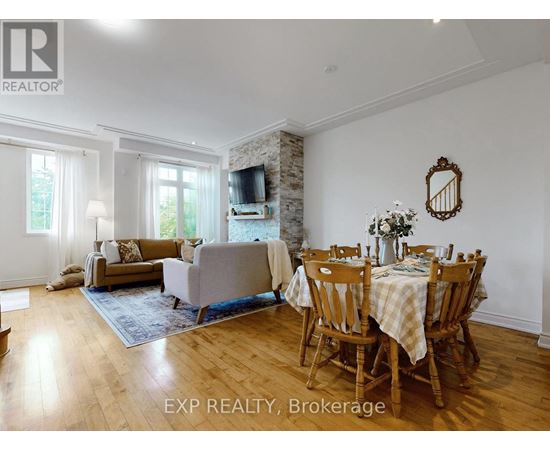 A dining room with a wooden table and chairs.