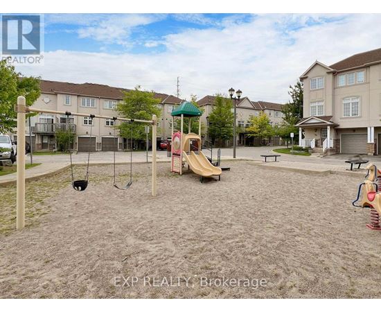A playground with a slide, swings, and sandbox in a residential area.