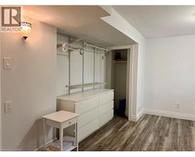 A room with a white cabinet and a small table.
