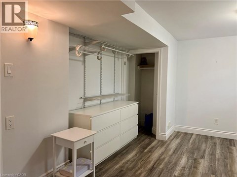 A room with a white cabinet and a small table.