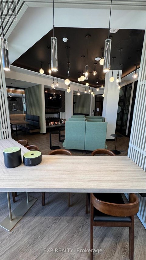 A dining area with a table and chairs.