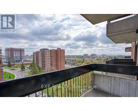 A balcony with a view of a cityscape and buildings.