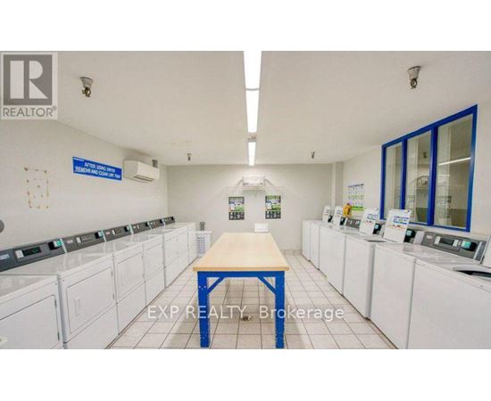 A laundromat with a sign that says EXP Realty Brokerage.