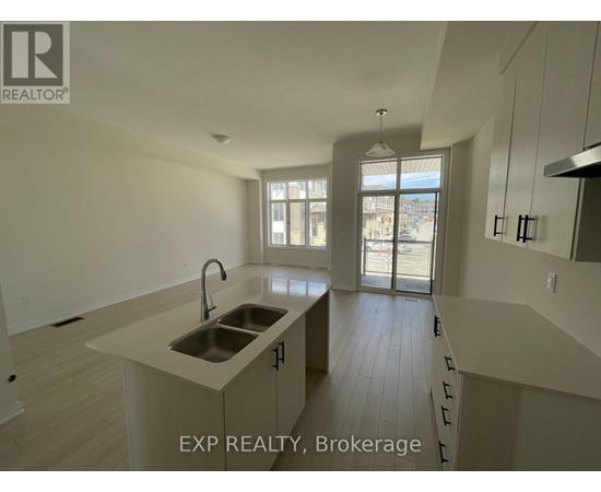 A kitchen with a sink and a window.