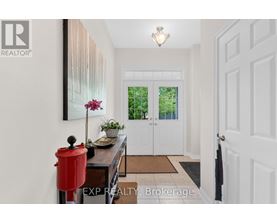 A white door with a black handle is on the right side of the image.