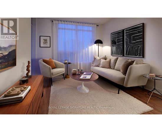 A living room with a couch, chair, and a coffee table.