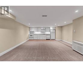 A spacious room with a washer and dryer unit.