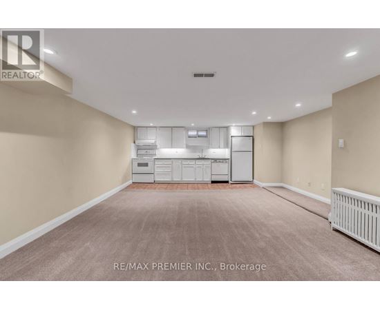 A spacious room with a washer and dryer unit.