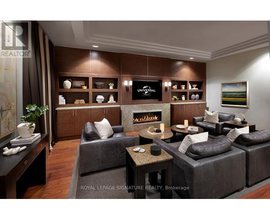 A living room with a grey couch and a coffee table.