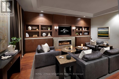 A living room with a grey couch and a coffee table.