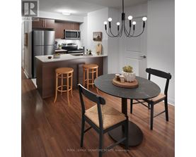 A modern kitchen with a dining table and chairs.