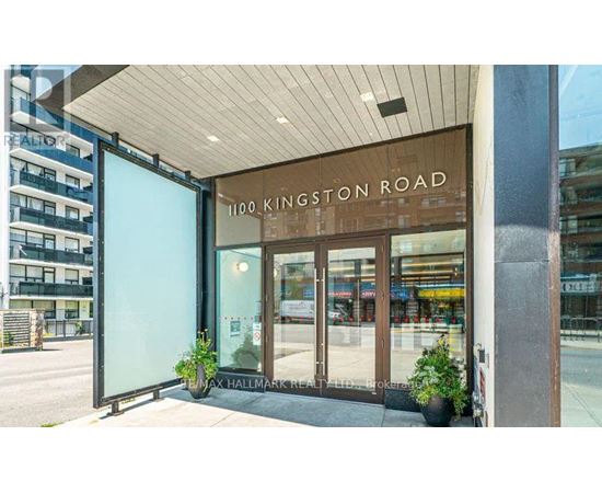 The entrance to a building with a glass door and a sign that reads "1100 Kingston Road".