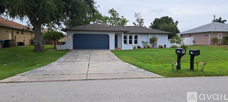 A house with a driveway and a mailbox.