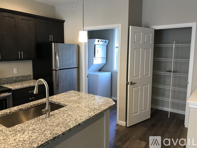 A kitchen with granite countertops and a sink.