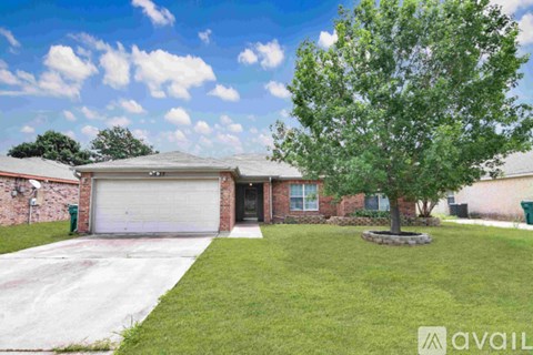 A house with a tree in front of it.