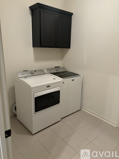 A white oven and microwave in a kitchen.