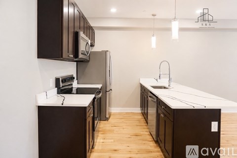 A kitchen with brown cabinets and a white countertop.