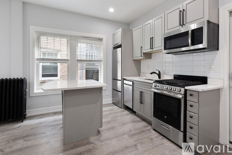 A kitchen with a black stove top oven and a white counter top.