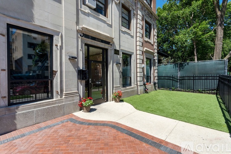 A building with a brick walkway in front of it.