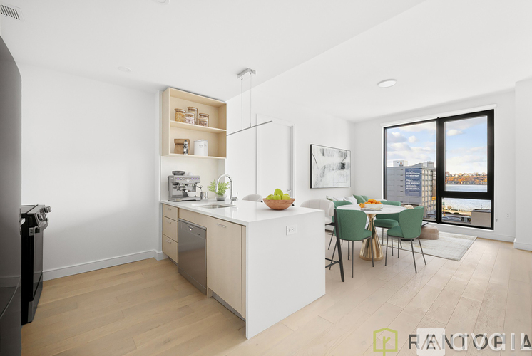 A modern kitchen with a dining table and chairs.