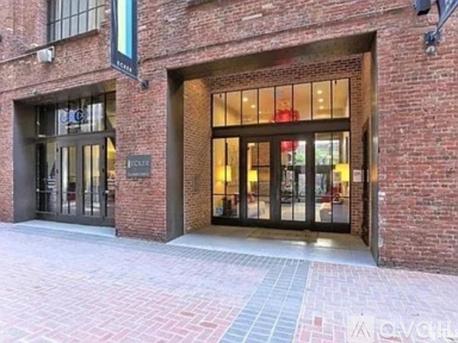 A brick building with a glass door entrance.