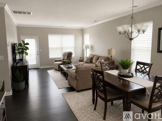 A well-lit living room with a dining table and chairs.