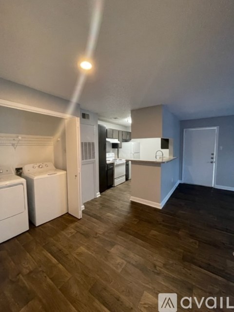 A laundry room with a washer and dryer.